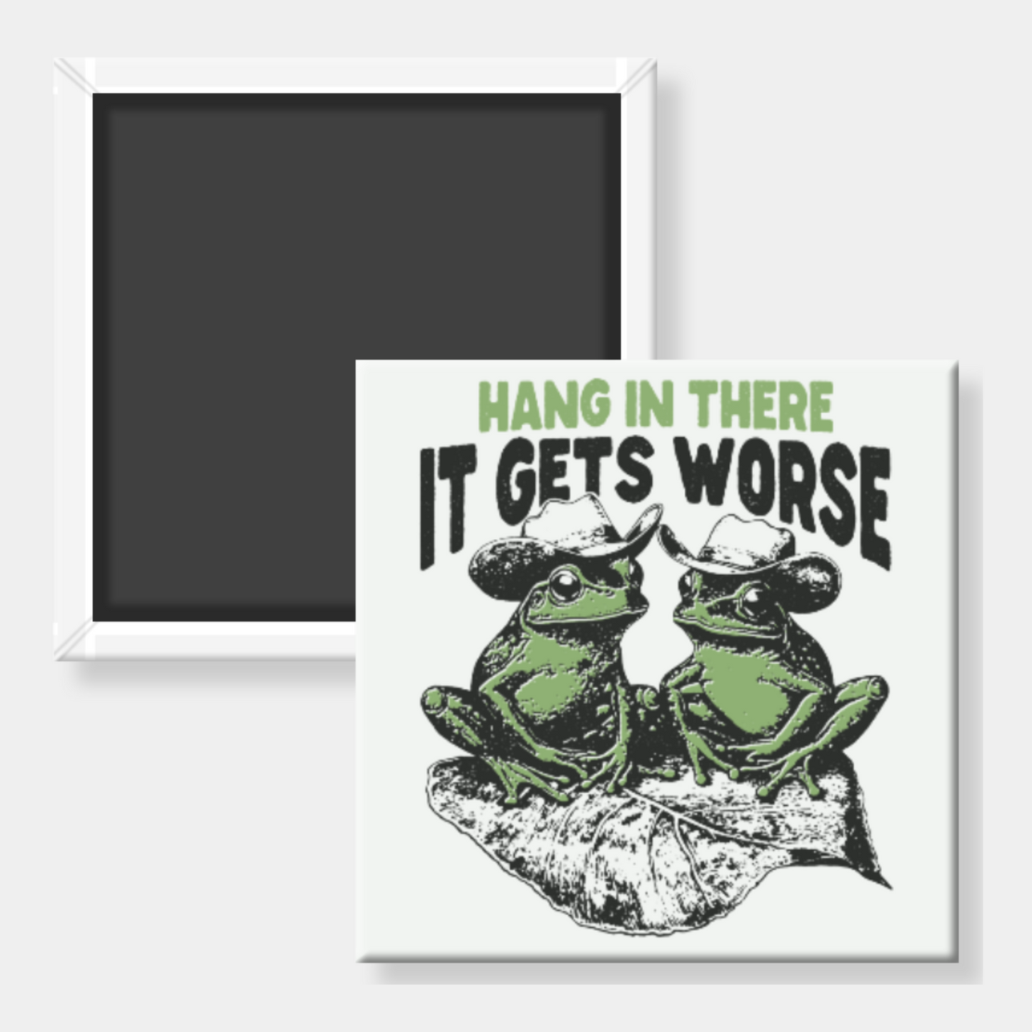 Square magnet with print with two frogs wearing cowboy hats and text 'Hang in there it gets worse' on a white background.
