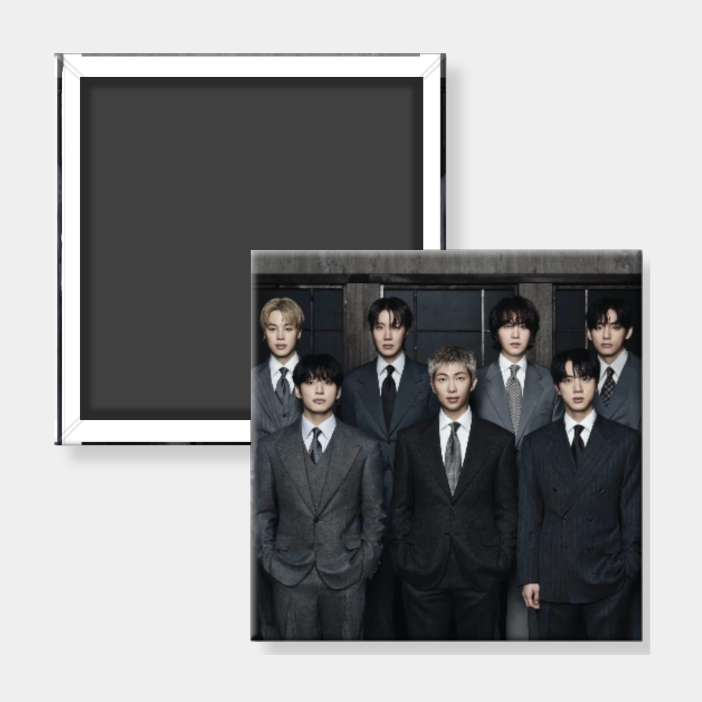 Group photo of men in suits with a black frame on a white background