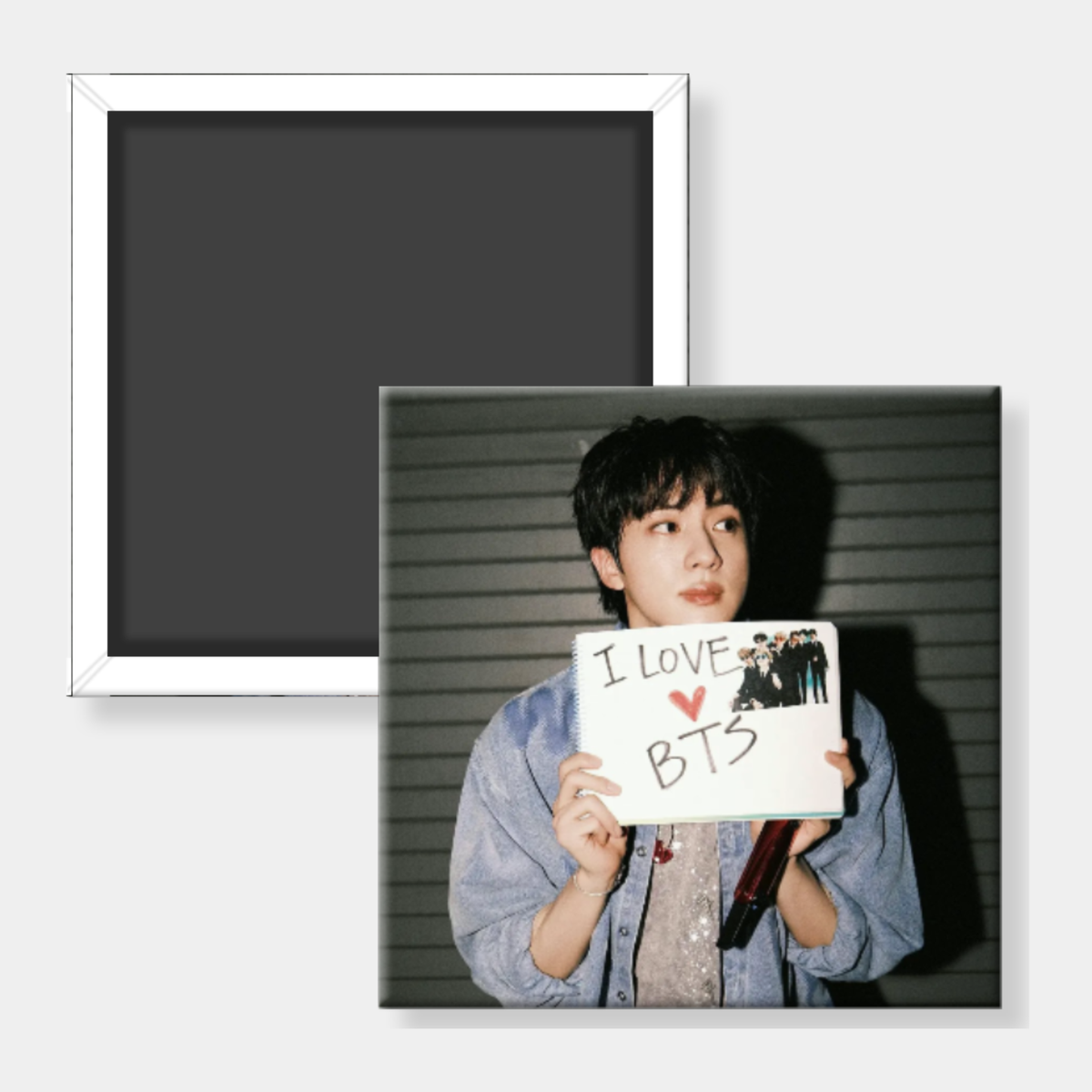 A square photo magnet featuring a portrait of a young man holding a sign that reads 'I LOVE BTS' with a small group photo, shown alongside the back of another magnet with a white border on a light gray background.