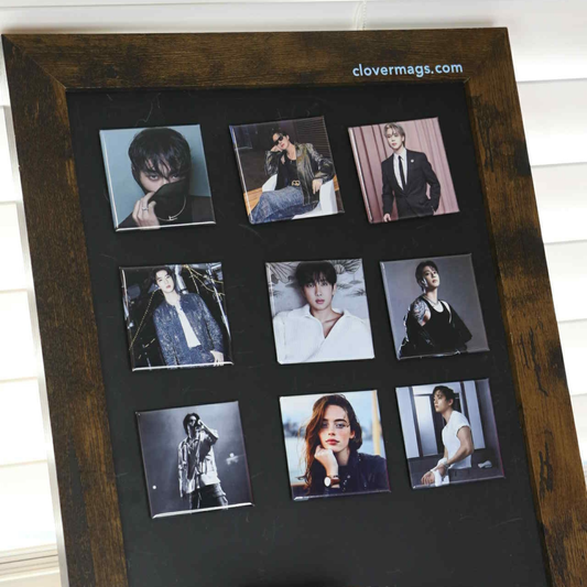 Wooden photo frame with multiple square magnets  on a black background