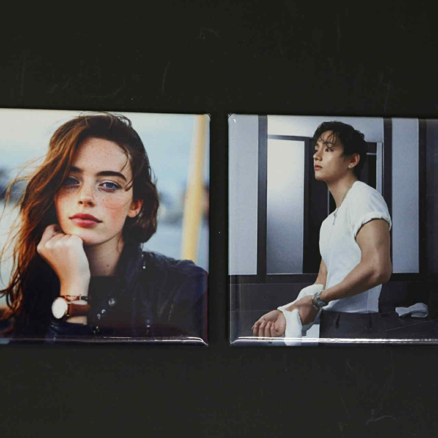 Two square photo magnets of a woman and a man on a dark background