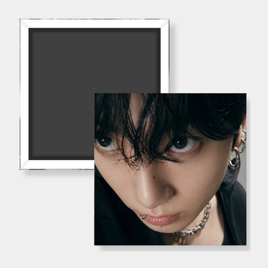 Close-up of Jungkook fridge magnet on white background