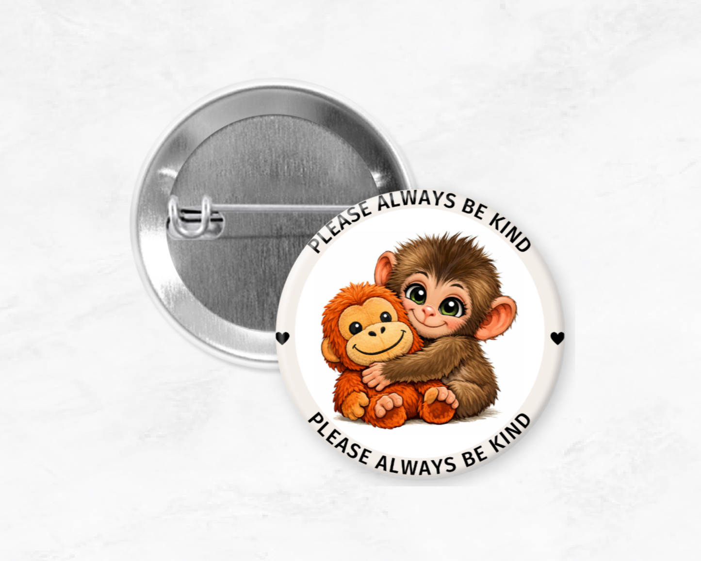 Button badge with cartoon monkeys and 'Please always be kind' text on a white background