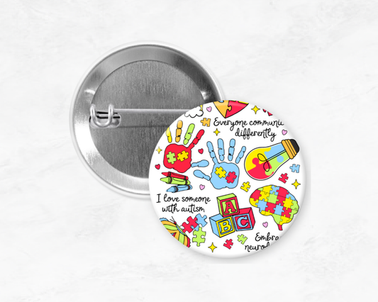 Button badge with colorful design and text on a white background